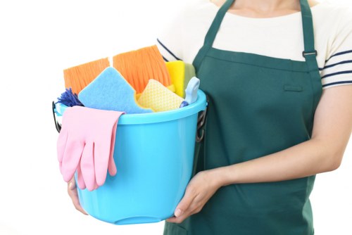 After builders cleaning team removing dust and debris from a renovated room