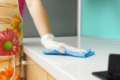 Vacuuming a mattress during a cleaning routine