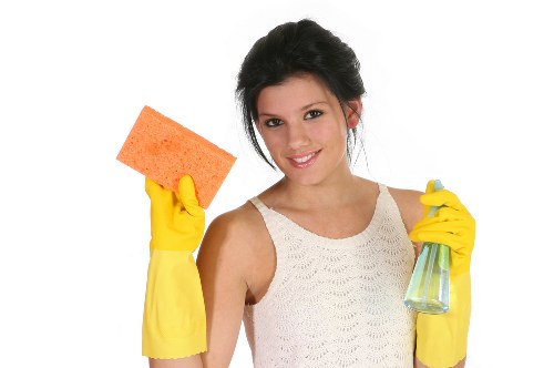 Cleaning team performing commercial cleaning tasks in a workplace
